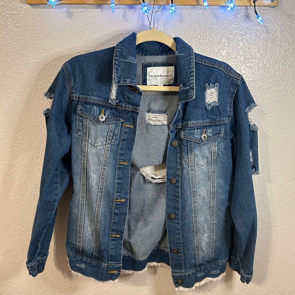 Jean jacket. Distressed. New without tags. Excellent condition